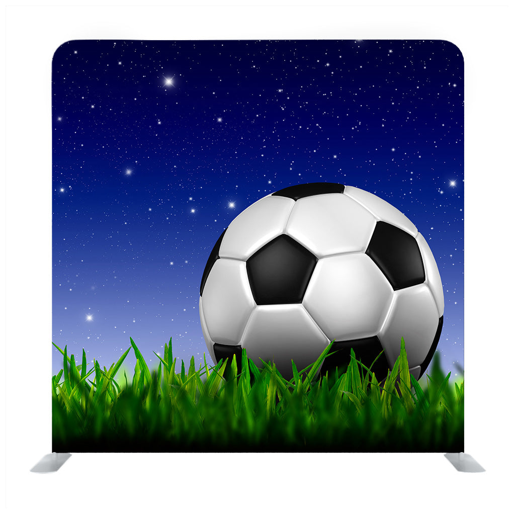 Football in green grass over a twilight sky Media wall - Backdropsource