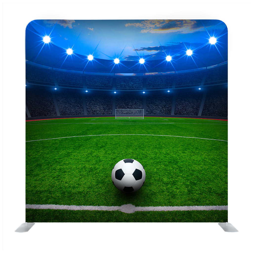 Soccer Ball On Green Stadium Arena In Night Illuminated Blue Bright Spotlights Background Media Wall - Backdropsource